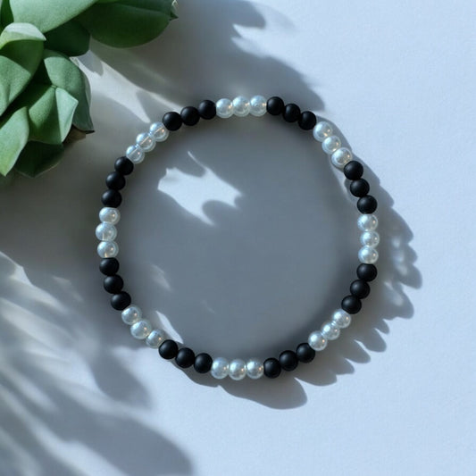 7.5 Inch Matte Black Onyx and White Glass-Pearl Bead Stretch Bracelet