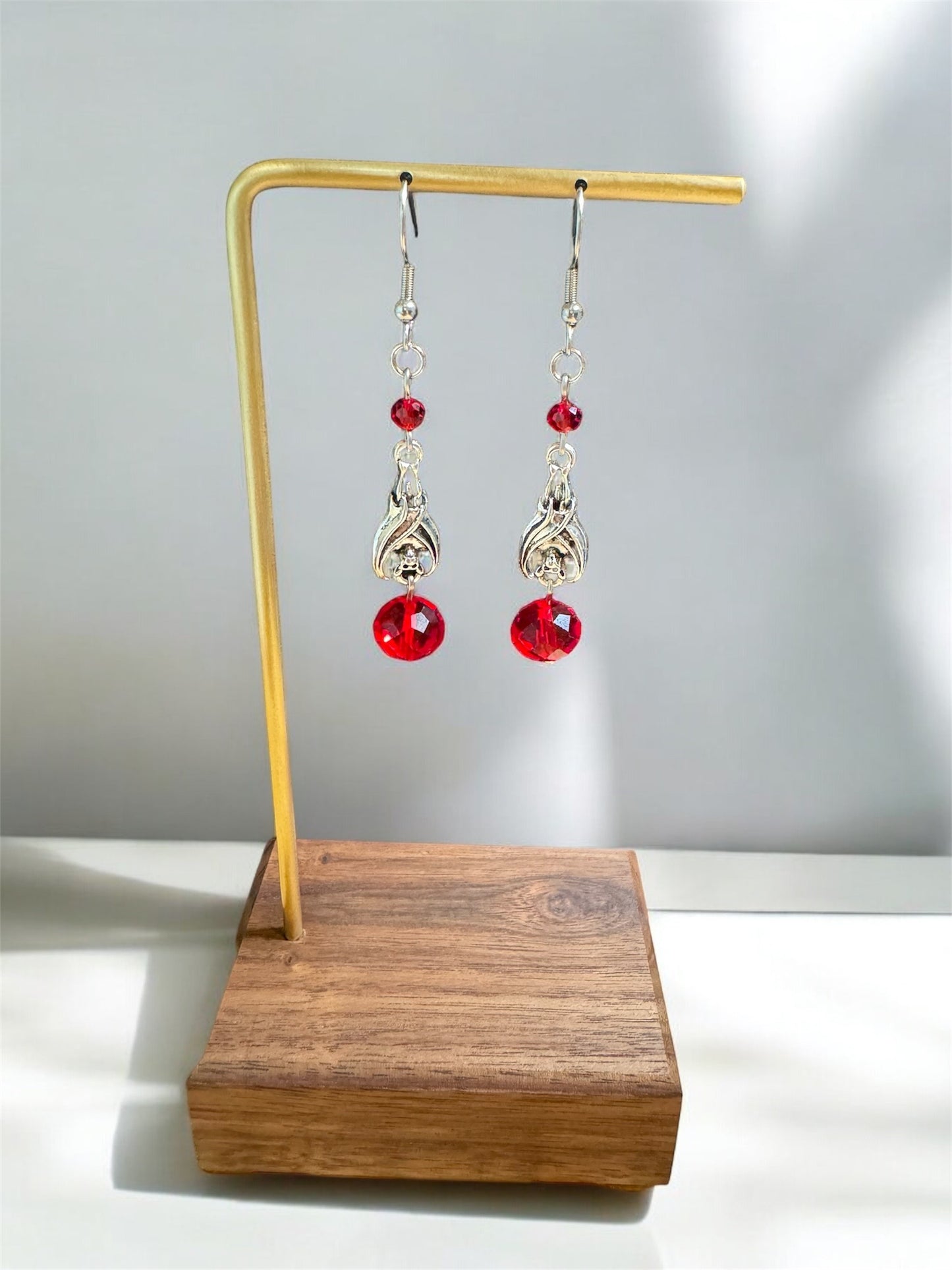 Silver Sleeping Bat and Red Glass Bead Dangle Earrings